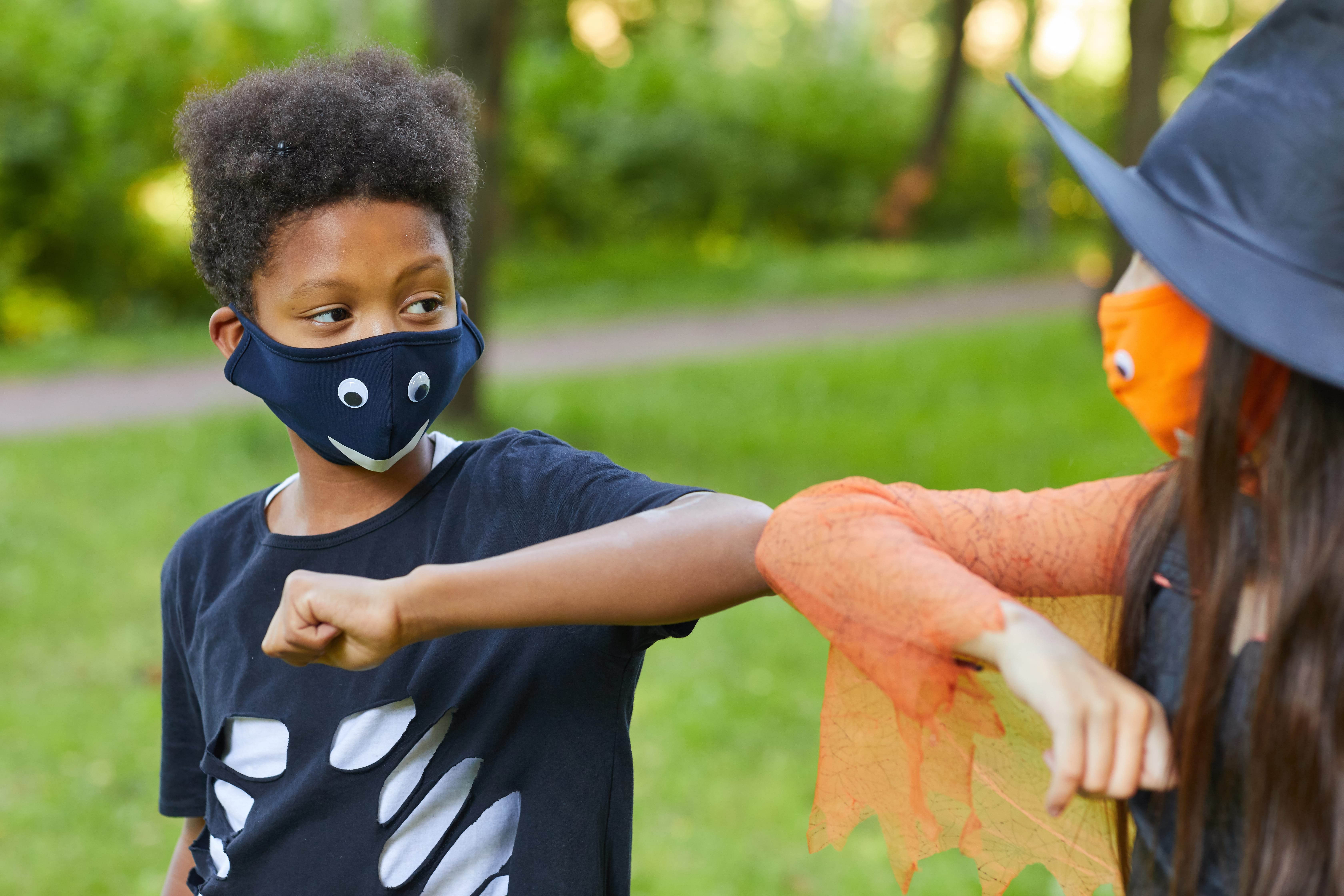 african-boy-costume-playing-with-his-friend-park-outdoors.jpg