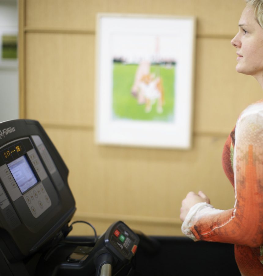 A lady running on a treadmill