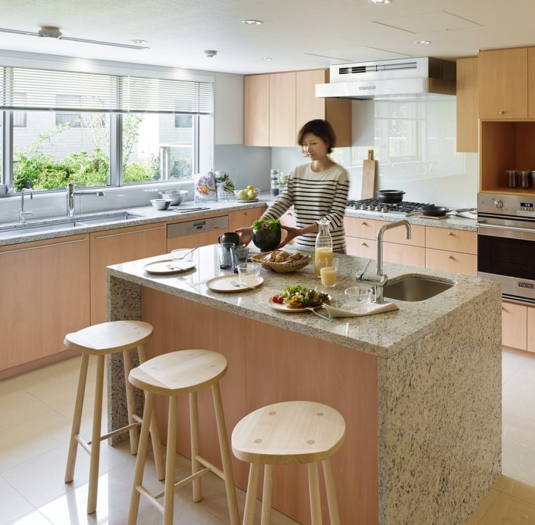 A lady cooking in the kitchen